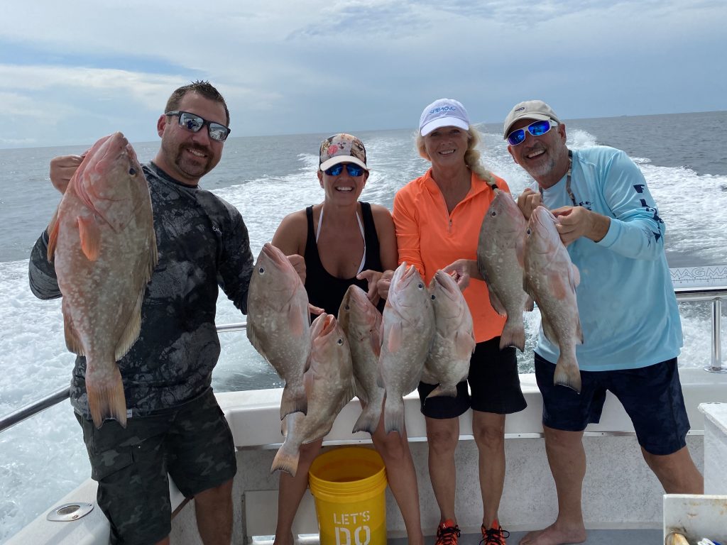 Anglers with catch of grouper caught on A and B Charters, Naples FL